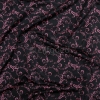 lycra zwart met oud roze print